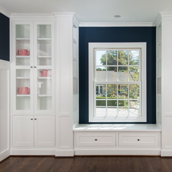 window surrounded by storage cabinets